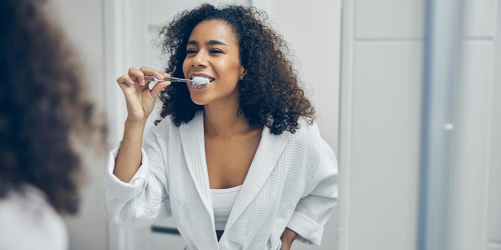 Woman brushing her teeth