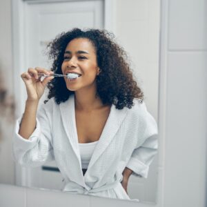 Woman brushing her teeth