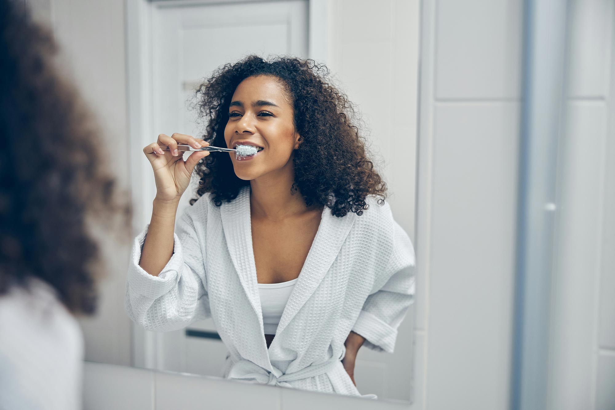 Woman brushing her teeth