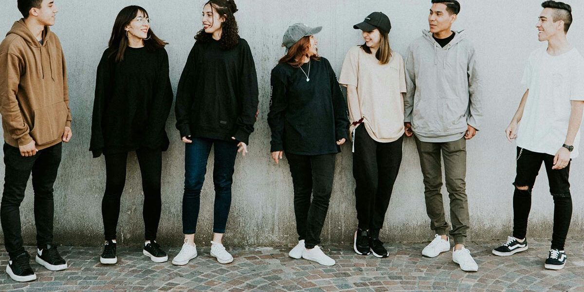 MI and Youth Group of young adults standing in a line facing the camera