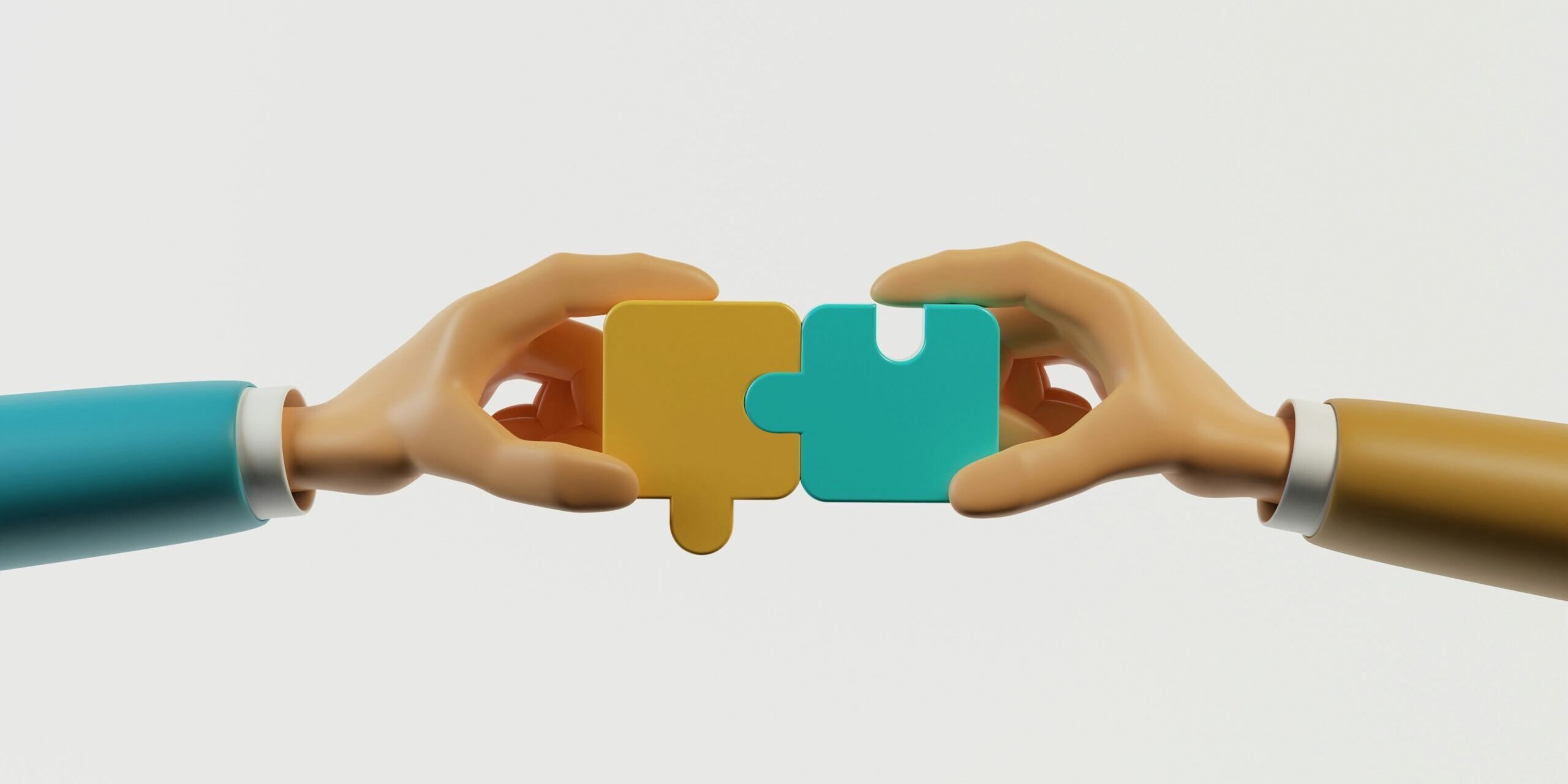 Shared decision making image Two hands meeting by putting two puzzle pieces together.